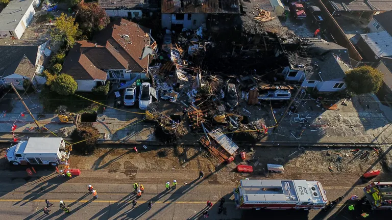Aerial photo of a destroyed Hayward, California neighborhood showing collapsed homes