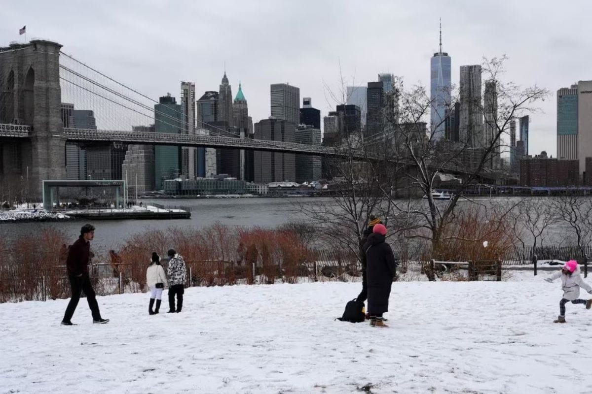 Snow-covered streets in New York City during major Northeast blizzard causing flight cancellations and travel disruptions