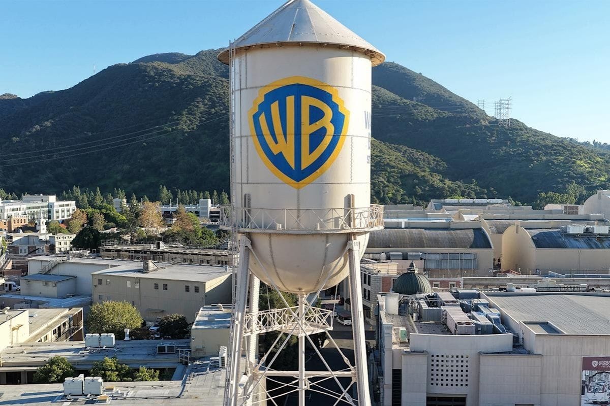 Warner Bros Discovery and Paramount logos amid reports of revised acquisition bid affecting Netflix deal