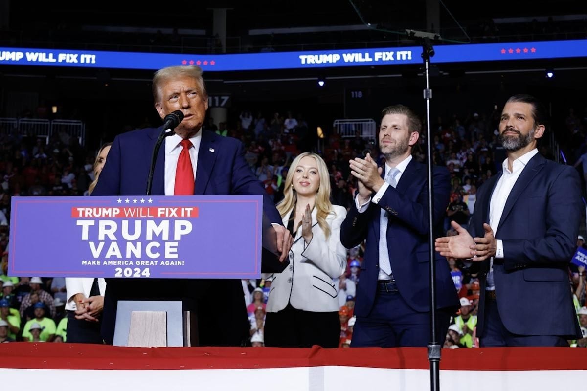 Donald Trump with sons Donald Trump Jr. and Eric Trump amid IRS lawsuit over leaked tax records