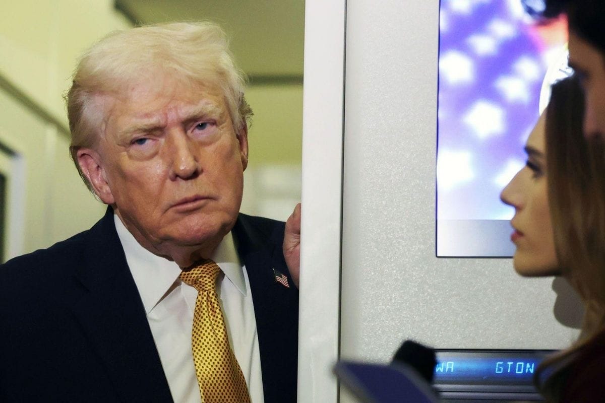 Donald Trump speaks to a reporter amid rising global tensions after Venezuela operation.