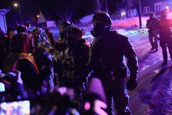 Federal agents face protesters in Minneapolis after officer-involved shooting during arrest.
